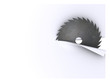 circular saw blade cuts sheet of paper