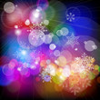 snowflakes falling on background of twinkling lights