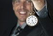 Smiling Businessman Dangles Antique Pocketwatch
