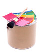 color samples with a brush on a paint can isolated over white