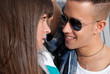 Young couple urban fashion flirting close-up portrait