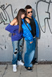 Young couple urban fashion standing portrait