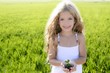 sprout plant growing from little girl hands outdoo