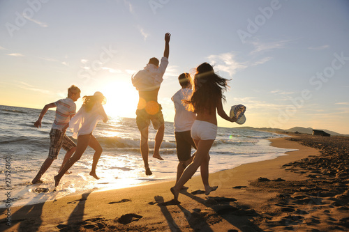 Photo: people group running on the beach people group running on the beach