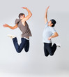 Photo: Two young male friends giving each other a high five Two young male friends giving each other a high five