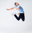 Excited young man performing a dancing act Excited young man performing a dancing act