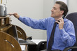 Photo: Businessman using his printer Businessman using his printer
