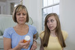 Foto: Mother showing concern about her daughter's pills Mother showing concern about her daughter's pills