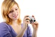 young beautiful woman with a camera (white background)