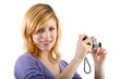 young beautiful woman with a camera (white background)