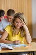 Photo: students in a library studying students in a library studying