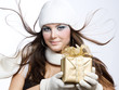 Beautiful Happy Girl with Christmas Gift.Snow