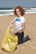 Beach clean up: Volunteer collecting waste