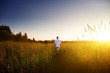 young man walking on field young man walking on field