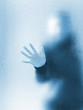 Foto: Silhouette of a girl through frosted glass Silhouette of a girl through frosted glass