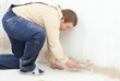 student worker paint wall with small roller student worker paint wall with small roller