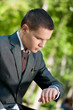 business man waiting at park. Watch. Student