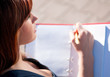 business woman reviewing diary at city park