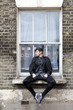 Photo: young man in old-fashioned clothes young man in old-fashioned clothes