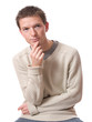 pensive young man looking up isolated over white background