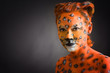 Woman painted as leoparde