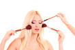 Beautiful young blonde woman with bright make-up and many brushe Beautiful young blonde woman with bright make-up and many brushe