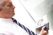 Mature man counting money