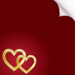 Two golden hearts on a red background Two golden hearts on a red background