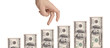 Hand gesturing moving over US dollars showing progress Hand gesturing moving over US dollars showing progress