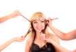 Beautiful young blonde woman with bright make-up and many brushe Beautiful young blonde woman with bright make-up and many brushe