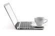 Cappuccino cup on laptop Cappuccino cup on laptop