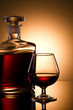 Still life with cognac glass and bottle in box Still life with cognac glass and bottle in box