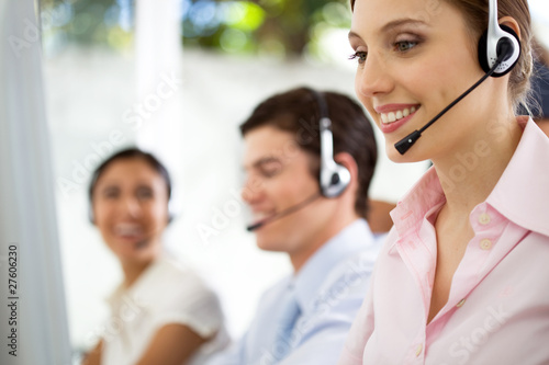 Photo: People working at a call center People working at a call center