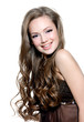 Beautiful happy young girl with  long curly hairs