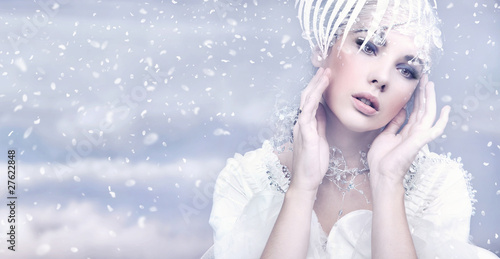 Photo: Beauty woman over winter background Beauty woman over winter background