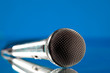 microphone against the blue background microphone against the blue background