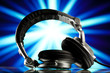 headphones against blue rays background