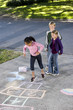 Photo: Kids playing hopscotch Kids playing hopscotch