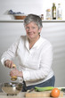 Women is a pepper mill in the kitchen