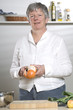 Women is peeling a Orange