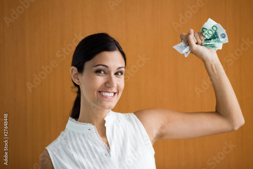 Photo: Woman holding money Woman holding money