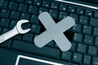 pc keyboard and wrench with bandage - computer repair