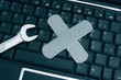 pc keyboard and wrench with bandage - computer repair