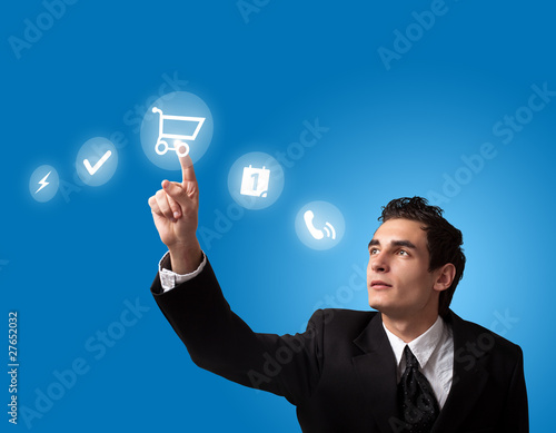 Photo: man pressing a touchscreen button man pressing a touchscreen button