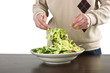 Man mixing fresh salad Man mixing fresh salad