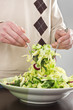 Man mixing fresh salad Man mixing fresh salad