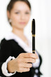 Portrait of a business woman holding pen in her hand Portrait of a business woman holding pen in her hand