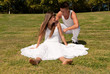 young couple happy sit on grass white clothes, love relationship