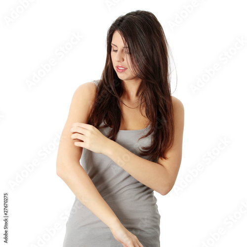 Photo: Woman scraching her self Woman scraching her self