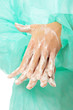 Female surgeon washing her hands Female surgeon washing her hands